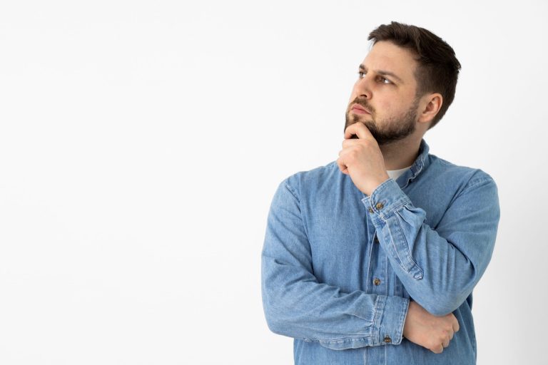 Man with hand on chin illustrates blog "Why Is My AC Filter Wet?"
