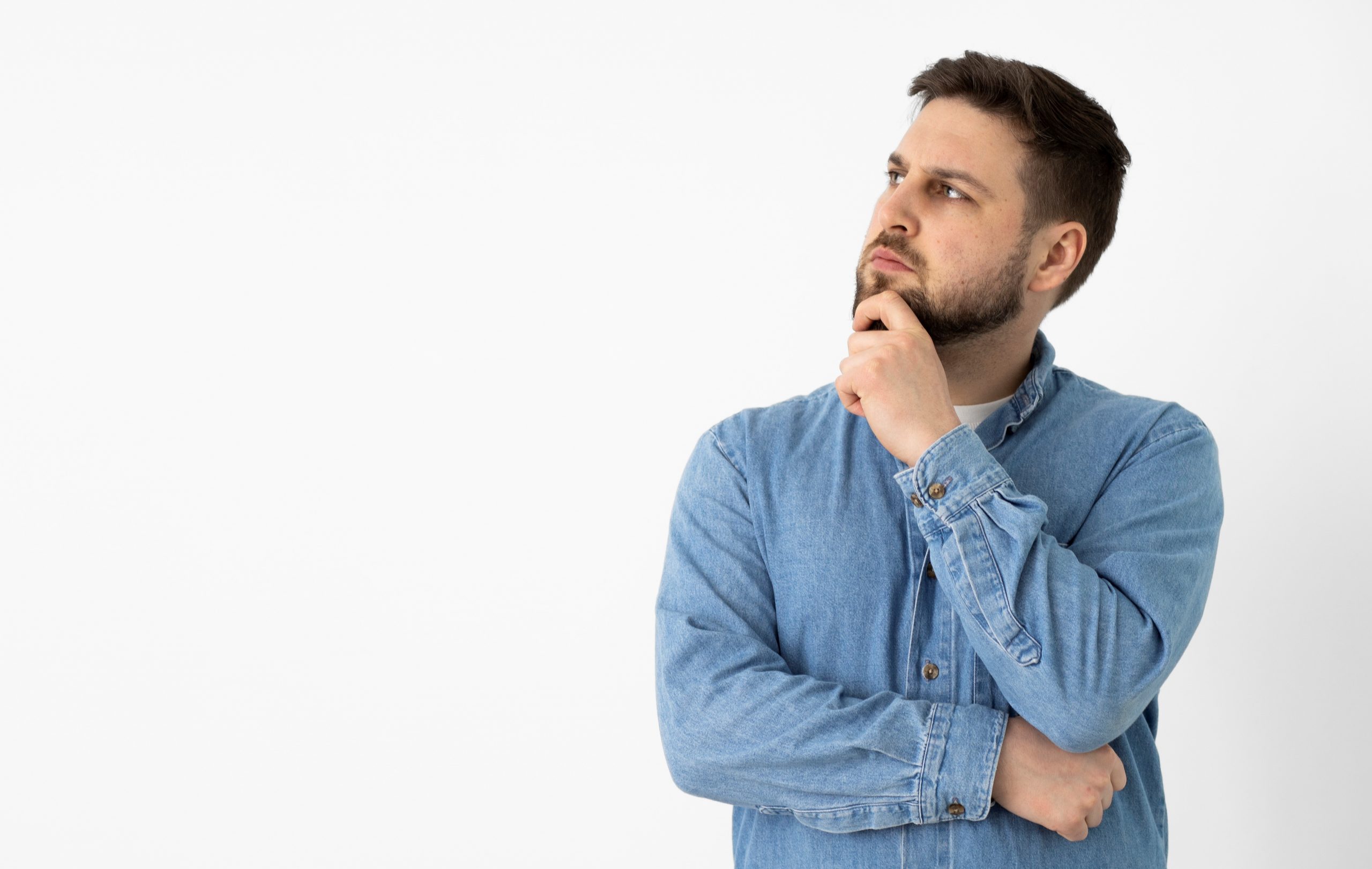 Man with hand on chin illustrates blog "Why Is My AC Filter Wet?"