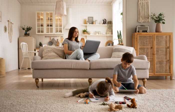 woman-living-room-kids-fp Woman in living room wih kids illustrate blog "Why Is My AC Filter So Dirty?"