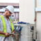 Texas summer AC maintenance on a central condenser in San Antonio