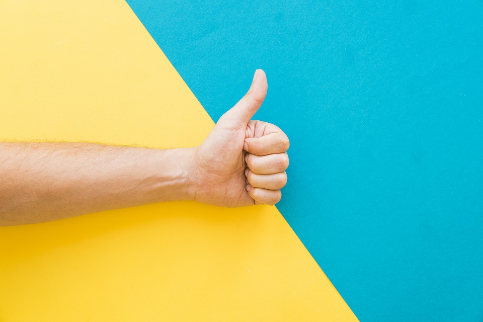 Hand giving thumbs up illustrates blog "The Importance of Regular Maintenance for Your Home AC System"